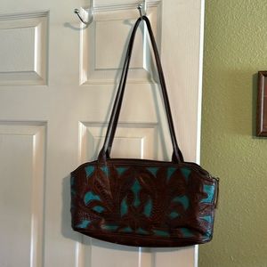 Leaders in leather hand bag cut out design